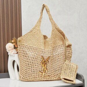 Stylish woven bag by St. Tropez. Features a chic gold chain and leather accents.